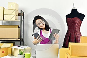 Online business, Young asian woman work at home for e-business commerce, Small business owner checking and packing online order.