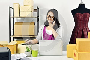 Online business, Young asian woman work at home for e-business commerce, Small business owner checking and packing online order.