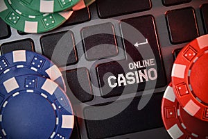 Online casino concept with keyboard and chips