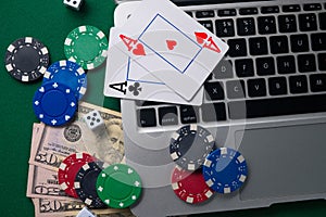 Online casino, poker. Background for business online games, poker, blackjack game. Online card games. Laptop, money and chips
