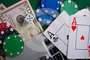 Online casino, poker. Background for business online games, poker, blackjack game. Online card games. Laptop, money and chips