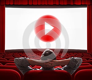 Online cinema screen with play media button in center