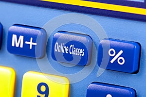 Online classes, text on calculator button, macro, extreme closeup. E-learning, covid 19 pandemic, coronavirus crisis education