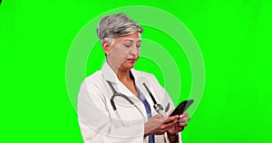 Online communication, female doctor on her smartphone and against a green screen for social networking. Connectivity or