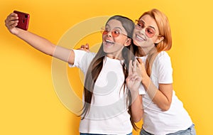 online communication. mom and kid bloggers. happy woman and girl take selfie