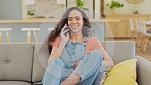 Online communication, woman on a phone call and on sofa in living room of her home for social networking. Connectivity