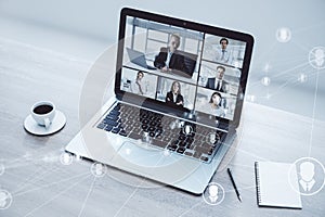 Online conference call with multiple participants on computer screen.