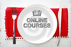 Online Courses concept on white plate photo