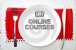 Online Courses concept on white plate