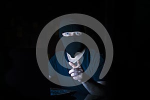 Online criminal in mask