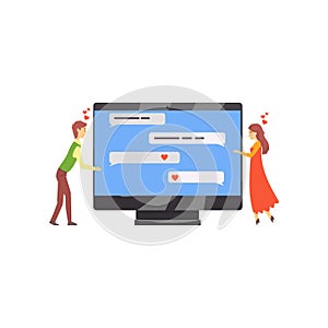 Online dating service or website concept with people talking in chat. Man and woman standing near computer screen