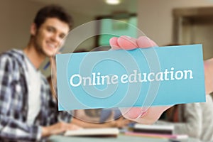 Online education against smiling friends sitting studying and using tablet pc