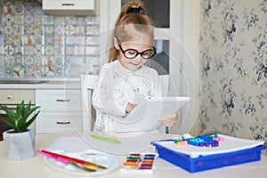Online Education concept. Little child girl using laptop