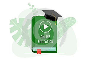 Online education with play video icon on green cover book and graduate cap. Academy hat on e-learning studying and