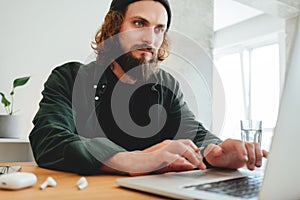 Online education. University student study while listening online lecture using laptop