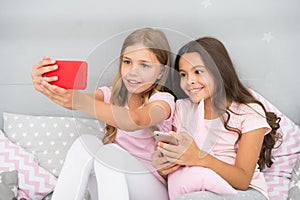 Online entertainment. Explore social network. Smartphone for entertainment. Kids taking selfie. Smartphone application