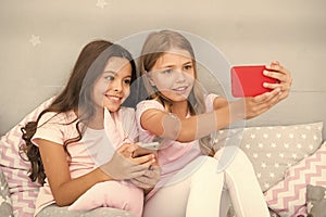 Online entertainment. Explore social network. Smartphone for entertainment. Kids taking selfie. Smartphone application