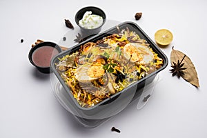 Online Food Delivery - Anda Pulao Or Egg Biryani packed in Plastic box