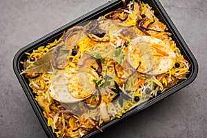 Online Food Delivery - Anda Pulao Or Egg Biryani packed in Plastic box