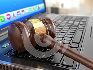 Online internet auction. Gavel on laptop.