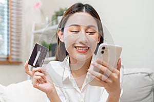 Online internet banking, asian young woman hand in payment spending by scan qr code, use phone, mobile to transfer money or pay