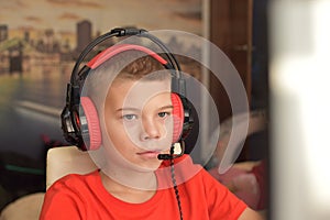 Online learning. boy is playing an online game on  internet. children`s gambling addiction