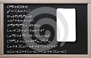 . Online learning, math classes. Tablet on the background of a class board with written mathematical formulas