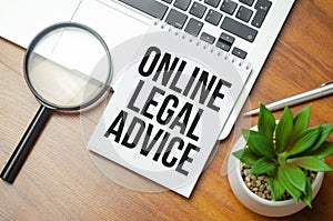 online legal advice words on notebook and laptop on wooden background