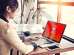 Online love concept: office girl using online dating website