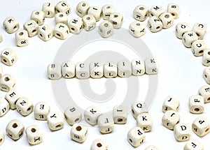 Online marketing term on white background wooden abc backlink photo