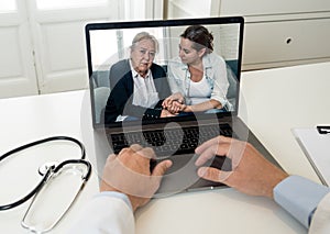 Online medical care. Senior mother and daughter on computer screen video calling online doctor