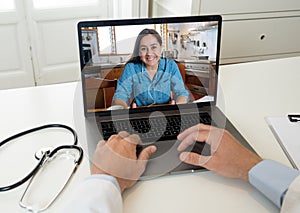 Online medical care. Woman on computer screen video calling online doctor in virtual consultation