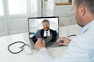 Online medical care. Woman on computer screen video calling online doctor in virtual consultation