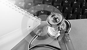 Online medicine stethoscope on computer keyboard. Modern medicine