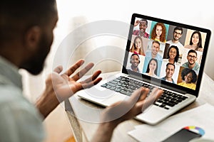 Online Meeting. Group Of Multiracial People Communicating Via Video Call On Laptop photo