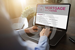 Online mortgage application on screen. Property loan. Business and financial concept.