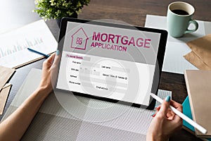 Online mortgage application on screen. Property loan. Business and financial concept.