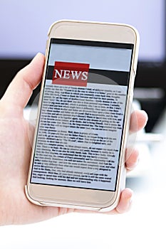 Online news on a mobile phone. Close up of businesswoman reading news or articles in a smartphone screen application.