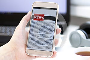 Online news on a mobile phone. Close up of businesswoman reading news or articles in a smartphone screen application.