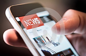 Online news in mobile phone. Close up of smartphone screen.