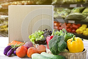 Online order grocery shopping concept. Food delivery ingredients service at home for cooking with packages box on wood table on
