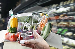 Online order grocery shopping on touch screen concept. Woman hand holding smart phone with checks the bar code or e-wallet on