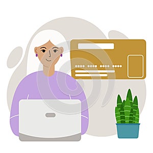 Online payment concept. Close up of a large credit card. A woman holding a laptop in his hand.