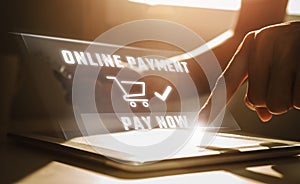 Online payment concept, Man using tablet computer and holding credit card at working desk. Banking and online shopping.