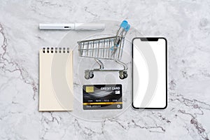 Online payment  concept with shopping cart top view