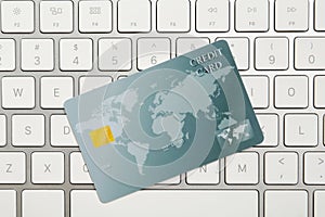 Online payment. Credit card on keyboard, top view