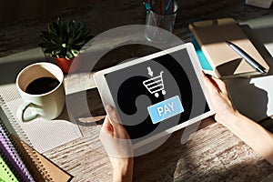 Online payment an e-commerce concept. Pay button on tablet screen.