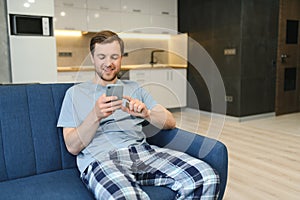 Online payment,Man holding a credit card and using smart phone for online shopping