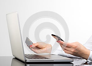 Online payment,Woman`s hands holding a credit card and using sma