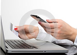 Online payment,Woman`s hands holding a credit card and using sma